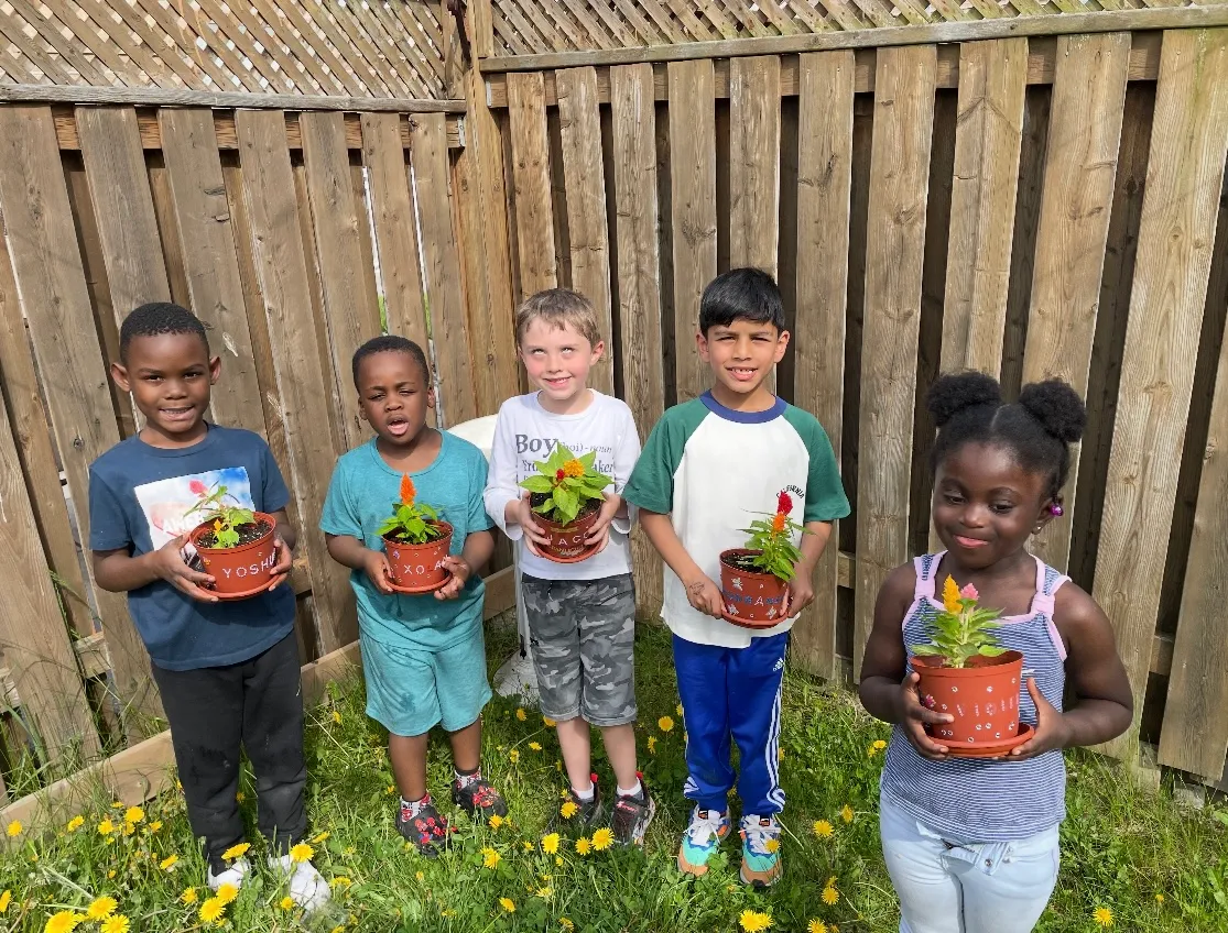 Photo of daycare kids gardening